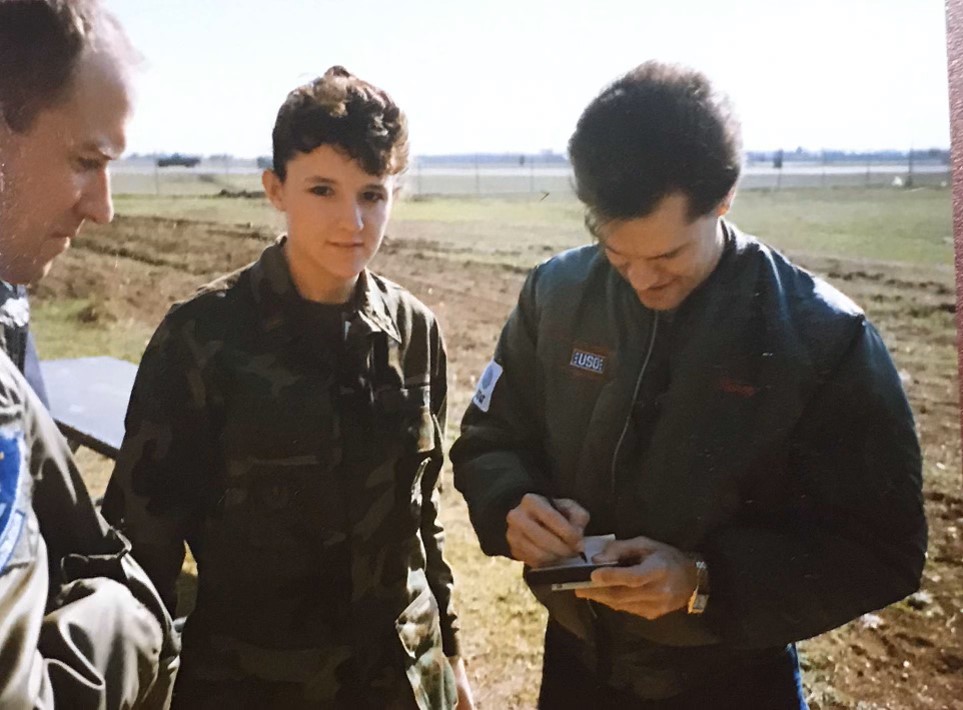 Cat and Dewey getting an autograph on the flightline — USO swing through the Gulf, 1991.